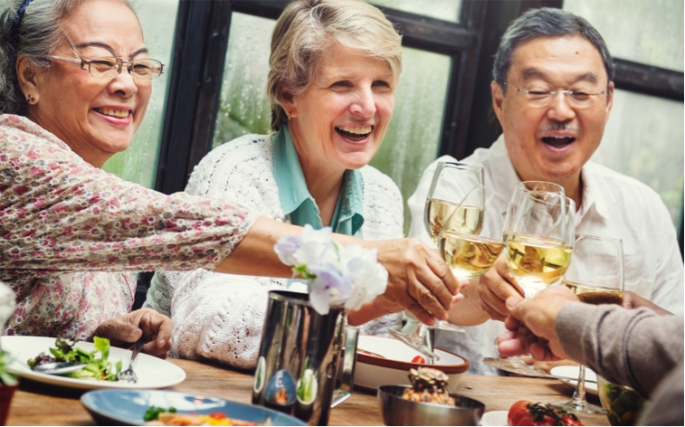 seniors-dining seniors having dinner and toasting with wine