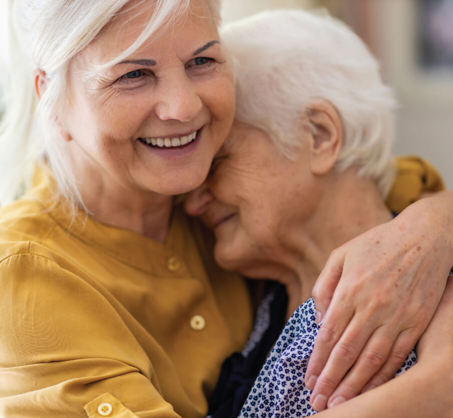 senior women hugging