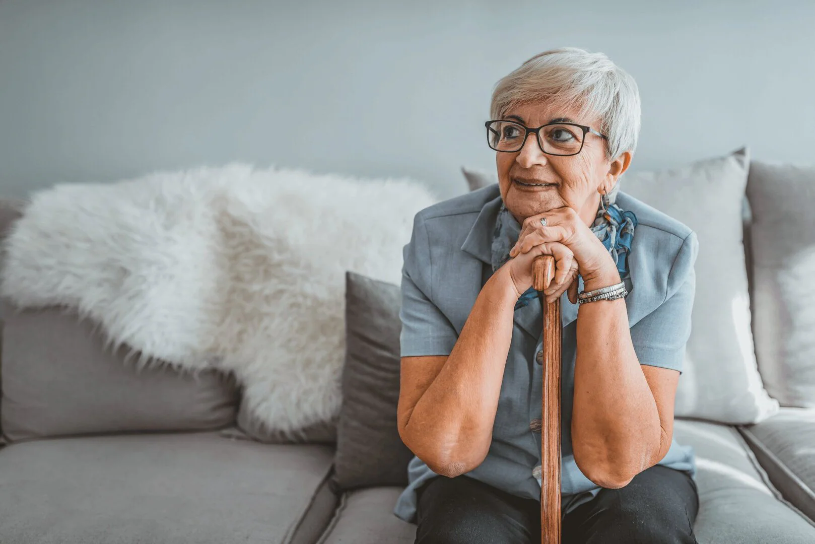 senior-woman-leaning-on-cane-1.jpg woman leaning on cane