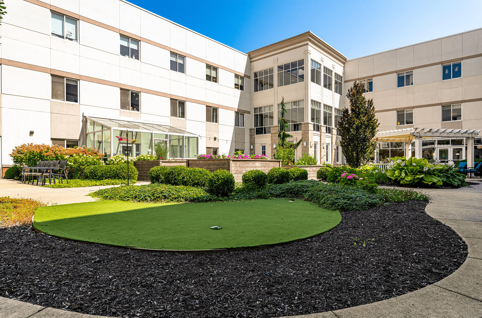 Avalon of Commerce Township senior living putting green in courtyard