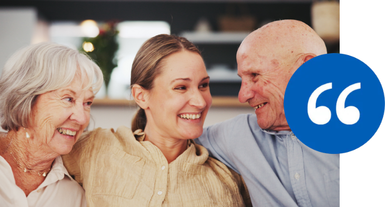 Adult woman sitting between her senior parents